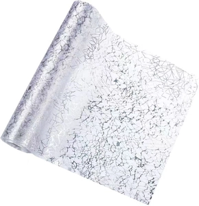 Detail of silver self-adhesive wallpaper with metallic crackle pattern and glossy finish