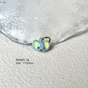 Close-up of cute 2g light blue cartoon koala pendant with 7x10mm size markings