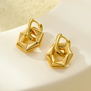 Minimalist golden stainless steel hexagonal hoop earrings on a neutral stone background