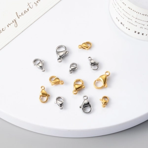 Detailed view of various sizes of gold and silver stainless steel lobster clasps for jewelry
