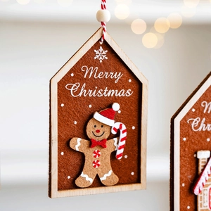 Close-up of wooden felt gingerbread man ornament with Merry Christmas text for tree decor