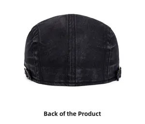 Rear view of washed black denim flat cap showing metal buckles and twill texture