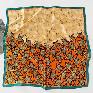 Silk-like square scarf with beige floral and orange maple leaf print on white background