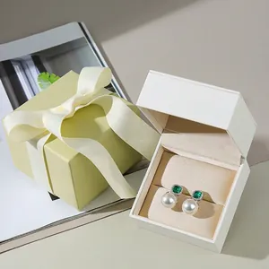 Elegant matcha green jewelry gift box with ribbon and white pearl earring display case