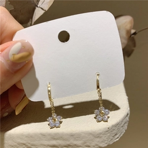 Elegant gold flower tassel earrings with sparkling rhinestones and delicate metal chain links
