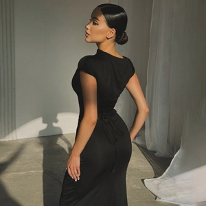 Detail of slim-fit black summer dress featuring open back design and adjustable lace-up ties