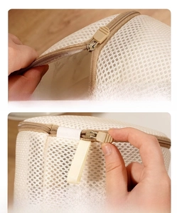 Detail of the sandwich mesh laundry bag showing the hidden auto-lock zipper and protective cover