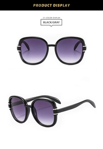 Detail view of square black fashion sunglasses with purple gradient lenses and glossy frame