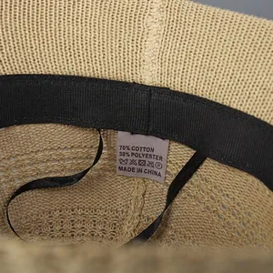 Beige hollow knit bucket hat with inner sweatband and detailed cotton fabric texture