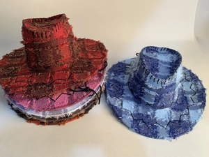 Detail of frayed edge plaid cowboy hats with hand-stitched brim and adjustable wind rope