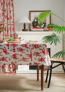 Detail of Christmas tablecloth with Santa Claus print on textured linen fabric