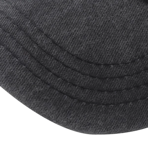 Macro shot of durable washed cotton fabric with reinforced stitching on a baseball cap brim
