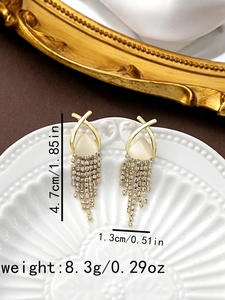 Detail shot of long gold tassel earrings with size 4.7cm by 1.3cm and weight 8.3g labels