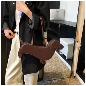 Detail of creative dachshund-shaped brown shoulder bag showing its unique canine design