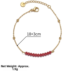 Detailed view of 14k gold-plated bead bracelet with red crystals and 18+3cm sizing