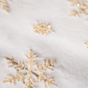 White plush Christmas tree skirt featuring golden sequined snowflake embroidery details
