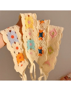 Detailed close-up of handmade crochet cotton bandanas with colorful floral patterns