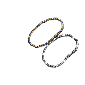 Gold and silver evil eye beaded elastic bracelets with 18K gold plated steel beads