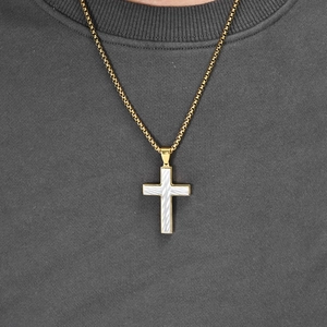 Men's gold cross pendant necklace with silver textures on a stylish box chain