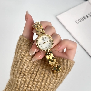 Golden honeycomb chain watch for women featuring a minimalist white dial and bee motif