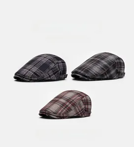Three British plaid newsboy hats with soft fabric texture and vintage metal side buckles