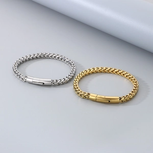 Detailed view of silver and gold braided stainless steel chain bracelets with clasp
