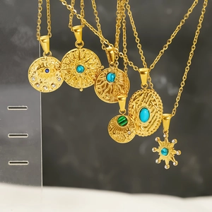 Vintage gold necklaces with turquoise and malachite pendants in a bohemian style