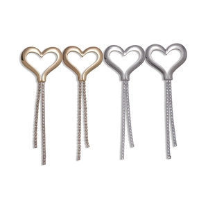 Elegant hollow heart tassel earrings in gold and silver finish with sparkling zircons