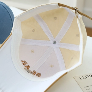 Close-up of internal six-panel stitching and embroidered brim of this kids baseball cap