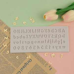Silicone alphabet and number mold for cake decorating on aesthetic pastel background