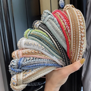 Knitted boho headbands with rhinestones and pearls shown in various colors