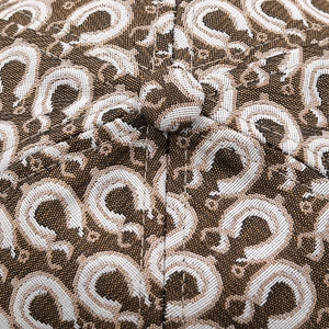 Macro detail of high-density jacquard leopard print baseball cap with button top