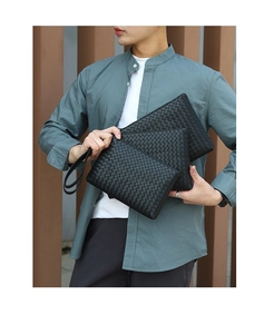 Detailed comparison of black woven leather clutches in three sizes for men