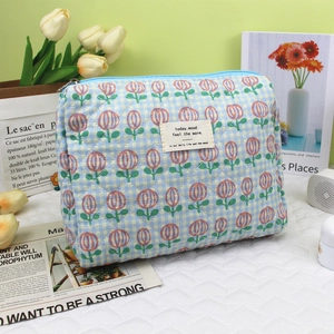 Quilted cotton makeup bag in blue and beige checkers with red tulip embroidery