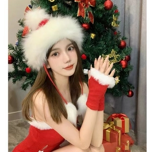 Detail of red festive Christmas hat and fingerless gloves with white plush trim
