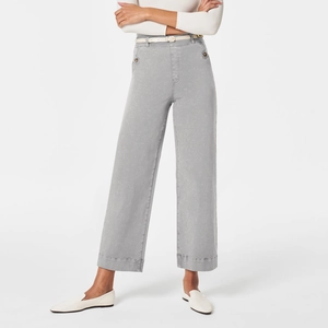 Detailed view of high-waist grey wide-leg trousers with thin white belt and denim texture