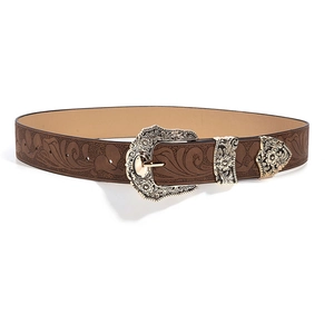 Detail of vintage brown leather belt with floral embossing and engraved silver buckle