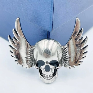 Gothic punk style winged skull brooch in antique silver finish for Halloween jewelry