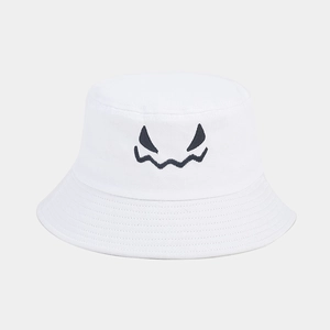 Close-up of spooky embroidered face on a white cotton Halloween bucket hat