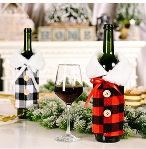 Detail of buffalo plaid wine bottle covers with faux fur collars and wooden buttons