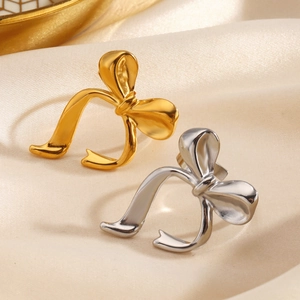 Minimalist polished stainless steel bow ring with adjustable open design in gold and silver