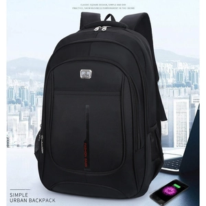 Detail of black Oxford fabric commuter backpack with S sport logo and front zip pockets
