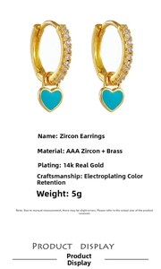 Detail view of heart-shaped drop earrings with turquoise inlay and AAA zircon accents