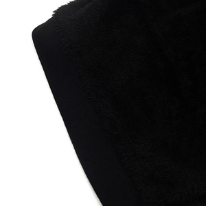 Macro detail of breathable black knit fabric with soft warm faux fur lining