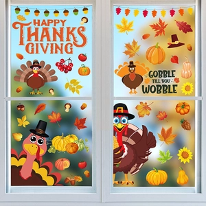 Detail of Thanksgiving window decals with maple leaves, turkeys and festive slogans