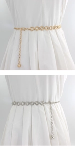 Detail of adjustable metal ring chain belt in gold and silver finish for dresses