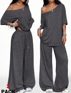 Detalle de conjunto gris con pantalones de pierna ancha de talle alto y tela de algodón