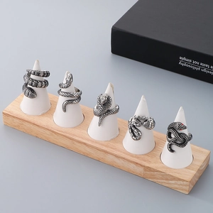 Collection of retro silver snake rings with detailed scales and red crystal eyes