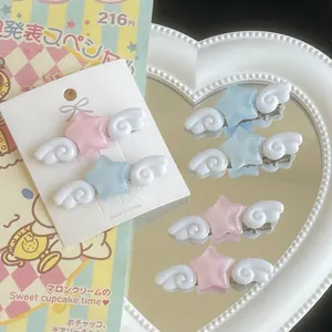 Sweet angel wing star hair clips in pastel pink and blue with sparkly glitter finish