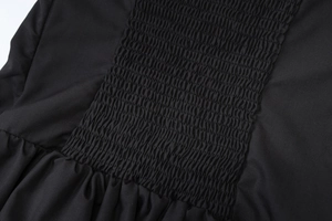 Detailed macro shot of the black ruched elastic strap with high-quality fabric texture
